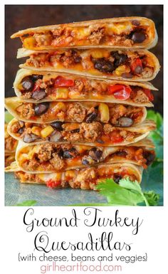 ground turkey quesadillas stacked on top of each other with cheese, beans and veggies