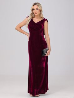 a woman in a long velvet dress