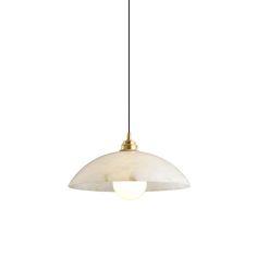 a white and gold light hanging from a ceiling