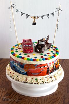 a birthday cake with cars on it