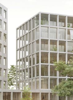 two tall white buildings next to each other with trees in the foreground and people walking on the sidewalk