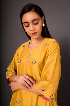 Mustard short kurta with floral embroidered motifs. Paired with pant.
Components:2
Embroidered
Neckline:Keyhole
Sleeve Length:Three quarter
Fabric:Chanderi
Color:Yellow
Floral motif work
Flared sleeves - Aza Fashions Spring Salwar Kameez With Dori Work, Embroidered Chanderi Pant Set, Spring Straight Kurta Set With Gota Work, Zari Work Pant Set For Summer, Spring Sets With Gota Work And Straight Kurta, Spring Unstitched Sets With Dori Work, Resham Embroidery Pant Set With Straight Kurta, Dori Work Sharara For Summer, Traditional Palazzo Set With Dori Work For Spring