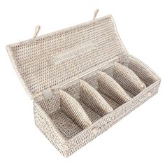 an empty wicker box with six compartments