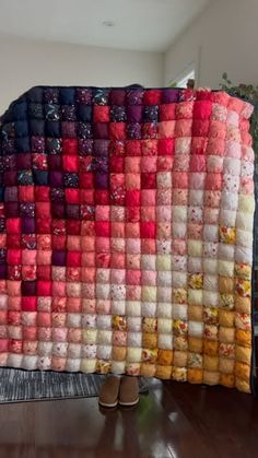 a blanket made out of many different colored squares