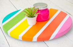 a potted plant sitting on top of a colorful table