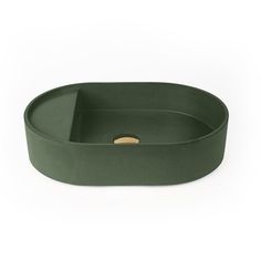 an oval green tray on a white background