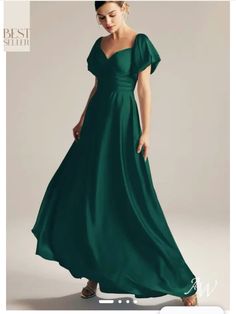 a woman in a long green dress