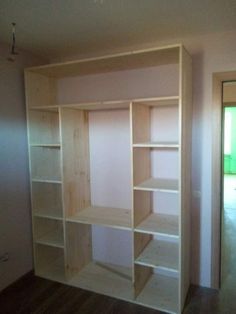 an empty room with some shelves in it