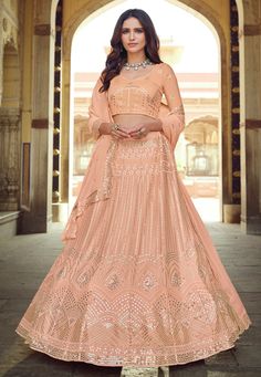 Peach georgette sequins work lehenga choli 7702  Desc:  Style : Circular Lehenga Choli Color : Peach Fabric : Georgette Work : Sequins   Thread Occasion : Wedding   Sangeet   Reception   Social Gathering   Lohri   Gudi Padwa Wash Care : Dry clean Sleeve Style : Half Sleeve Long Sleeves : Done only in Custom Stitch Sleeves Lining : Done only in Custom Stitch Bust Size: 32 to 42 Inches. With Express Free Shipping and Custom Stitching, Buy Indian Wedding Party Wear lehenga Peach georgette sequins w Peach Lehenga, Lehenga Jewellery, Georgette Lehenga, Resham Work, Party Wear Lehenga Choli, Work Lehenga, Georgette Dupatta, Peach Blouse, Lehenga Online