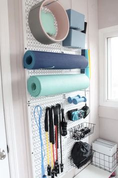 10 Small Home Gym Ideas That Work in Any Space | Apartment Therapy Gym Makeover, Small Home Gyms, Home Gym On A Budget, Basement Decoration, Small Home Gym, Pegboard Storage, Home Gym Garage, Workout Room Home, Mini Gym