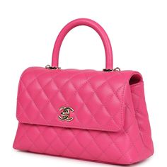 This Small Coco Handle Flap bag is of dark pink caviar with light gold tone hardware and has the signature diamond quilting in a trapezoidal shape with signature CC interlocking closure, top handle, and long light gold tone and pink leather chain.The interior is lined in pink leather with one zip pocket on the rear wall and one center divide slip pocket.Collection: 2023 (RFID)Origin: ItalyCondition: New and never worn Accompanied by: Chanel box, Chanel dustbag, carebook, and detachable shoulder strapMeasurements: 9" width x 5.75" height x 4" depth; 17" strap drop (3" handle) Designer Rectangular Bag With Diamond Quilting, Chic Top Handle Bag With Diamond Quilting, Elegant Quilted Pink Bag, Pink Formal Bags With Cc Turnlock Closure, Formal Pink Bags With Cc Turnlock Closure, Coco Handle, Chanel Box, Long Light, Pink Chanel