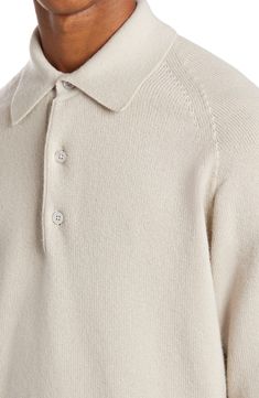 Mother-of-pearl buttons amplify the refined aesthetic of this polo sweater made from sumptously soft cashmere with seamless knitting. 25 1/2" length (size 48EU) Button half-placket Spread collar Long sleeves with ribbed cuffs 100% cashmere Dry clean Made in Italy Men's Designer Clothing Loro Piana Menswear, Classic Beige Long Sleeve Polo Sweater, Classic Long Sleeve Beige Polo Sweater, Beige Polo Collar Sweater For Fall, Beige Wool Polo Sweater With Ribbed Collar, Classic Cashmere Tops With Button Closure, Elegant Cream Polo Sweater For Fall, Elegant Collared Sweater With Button Cuffs, Beige Collared Cashmere Polo Sweater