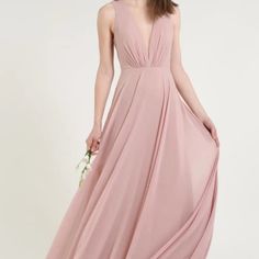 a woman in a long pink dress