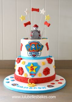 a birthday cake with a train on top and stars in the sky around it that says paw patrol