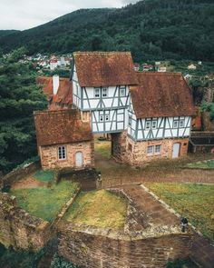 an aerial view of a house on top of a hill