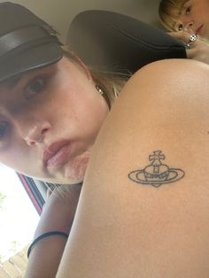 a woman with a small tattoo on her arm