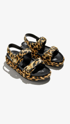 Elevate your look with our cheetah printed sandals. Effortlessly chic and versatile, these are the perfect addition to your wardrobe. Style them with a flowy dress or tailored shorts for a touch of bold elegance. Designer Sandals Flat, Flat Platform Sandals, Leopard Sandals, Tory Burch Kira, Sport Sandals, High Standards, Footwear Design Women, Designer Sandals, Brown Sandals