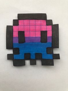 a piece of art made to look like an old school computer game character with pink, blue and black squares on it