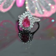 A Ladies 18K White Gold 6.5 X 8.5 Mm Pear Cut Ruby And Diamond Ring. There Are 36 Round Brilliant Cut Diamonds Having A Total Approximate Weight Of .72 Carats. The Ring Is Size 8.25 Luxury Pear-shaped Diamond Ring With 17 Jewels, Luxury Pear-shaped Ruby Ring, Luxury Pear-shaped Ruby Ring For Formal Occasions, Formal Pear-shaped Sapphire Ring With Brilliant Cut, Formal Vvs Clarity Pear-shaped Sapphire Ring, Formal Pear-shaped Sapphire Ring With Vvs Clarity, Luxury Teardrop Diamond Ring With Center Stone, Luxury Pear-shaped Sapphire Ring With Prong Setting, Teardrop Platinum Diamond Ring For Formal Occasions