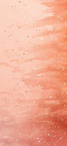 an orange and pink background with small white dots on the water, as well as light brown spots