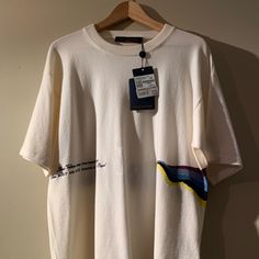 Brand New Louis Vuitton Graphic Tshirt Ss19 Virgil Abloh 100% Cashmere Deadstock Size: L Sku: 1a53yd Designer Crew Neck Tops For Summer, Designer Relaxed Fit Crew Neck Tops, Designer White Short Sleeve Tops, Designer White T-shirt For Spring, Louis Vuitton Shirts, Virgil Abloh, Cream White, Cashmere, Graphic Tshirt