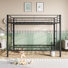 a black metal bunk bed in a room with pictures on the wall and flooring