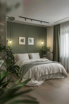 a bedroom with green walls and white bedding in the corner, along with potted plants