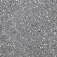 an asphalt surface with small white dots on the top and bottom, in grey tones