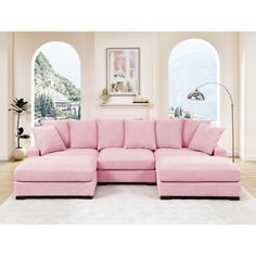 a pink sectional sofa in a living room