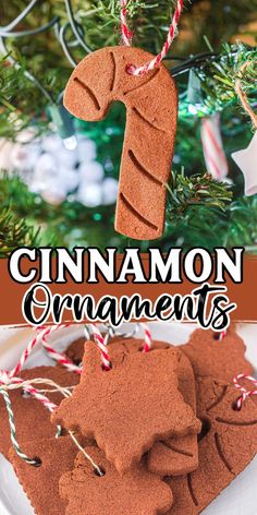 cinnamon ornament cookies on a plate next to a christmas tree with candy canes