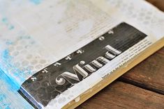 an open book sitting on top of a wooden table