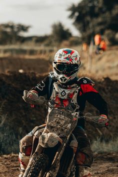 a man riding on the back of a dirt bike