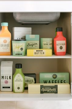 an open refrigerator filled with lots of different types of juices and condiments