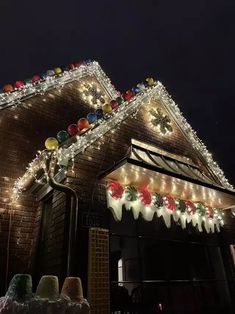 christmas lights decorate the roof of a house