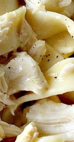 closeup of pasta shells with garlic and seasoning on the top, ready to be eaten