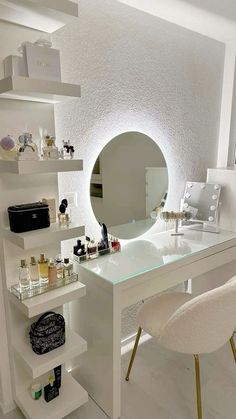 a white desk topped with a mirror and lots of bottles