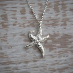 Starfish Pendant Necklace beautifully detailed in Sterling Silver, silver starfish, sea creatures, starfish necklace 🏖 Gorgeous sea creature works well on both a long chain and short, this is an incredibly eye-catching piece. Beautiful gift for someone special whether that's a best Friend, sister, girlfriend, wife or mother. Or you 🪸 🐚 Chain length in photo: 45cm / 17.7inch Starfish: 2.6cm / 1.0inch x 2.0cm / 0.78inch Beautifully detailed Sterling Silver starfish pendant necklace, silver star Ocean-inspired Silver Necklace With Star Charm, Starfish Pendant, Pendant Necklace Silver, Starfish Necklace, A Best Friend, Sea Creature, Long Chain, Silver Stars, Sea Creatures