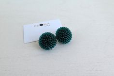 Teal green round textured clip on earrings are crocheted with Czech seed beads.  Dewberry clip on earrings is ~20 mm / ~0.8 in diameter  or ~16 mm / ~0.6 in diameter. Various other colors are available (fe choose here http://www.etsy.com/shop/EdoraJewels?section_id=14159426&ref=shopsection_leftnav_1) The earrings will be shipped with a registered priority post. Handmade Green Round Clip-on Earrings, Green Circle, Circle Earrings Studs, Circle Studs, White Texture, Purse Charms, Cute Packaging, Teal Green, Lithuania