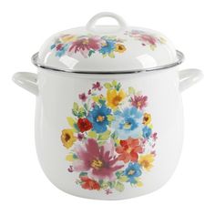 a white casserole with colorful flowers painted on the side and lid is sitting in front of a white background