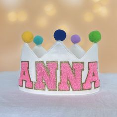 We are dedicated to customizing products. We are excited to introduce this adorable birthday crown. Made from high-quality yarn, this crown features a pom-pom on top that adds a distinctive and lively touch. Wearing it at a birthday party and taking photos will create unforgettable memories. Birthdays are special days, and every parent puts a lot of effort into making them fun and memorable for their little ones. This also makes a unique gift for children. The birthday crown measures 3.8 inches Whimsical White Party Supplies For Birthday, Whimsical White Birthday Party Supplies, Whimsical Tall Crown For Birthday, Adjustable Round Crown For Birthday, Birthday Gold Crown, Cute Birthday Crown With Round Shape, Princess Crown With Pinched Crown For Birthday, Diy Felt Crown Birthday, Princess Crown Party Supplies For Birthday