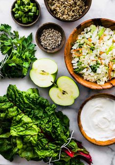 the ingredients to make this salad are neatly arranged in bowls and ready to be eaten