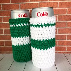 two crocheted coffee cups sitting next to each other