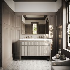 a bathroom with two sinks and a large mirror in it's center area,