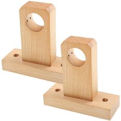 two wooden blocks with holes in the middle