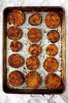 some food is sitting on a baking sheet and ready to be cooked in the oven