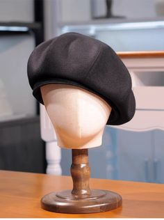 a hat is sitting on top of a mannequin head