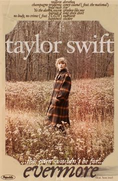 taylor swift is standing in the middle of a field