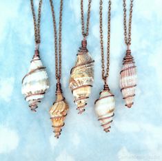 These beautiful natural sea shell necklaces are made with lovely spiral shells and antique copper jewelry wire. Each pendant is unique, with varying colors and sizes, but maintains the same swirled wire design. They hang on delicate, yet sturdy 2mm antiqued copper cable chain necklaces, which are cut and finished by hand with lobster clasp closures. The shells vary in size, measuring around 1.5 to 2.1 inches long, and they are about 0.4 to 0.7 inches wide in the middle section. These boho-styled Wire Wrapped Seashells, Mermaid Jewelry Necklaces, Shell Wire Wrap, Sea Shell Pendant, Wire Wrapped Shell Jewelry, Wire Wrapped Sea Shells, Wire Wrapping Shells, Shell Pendant Necklace, Sea Shell Necklace Diy