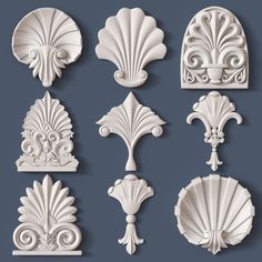 decorative plaster molds in the form of florets, leaves and scrolls on a blue background