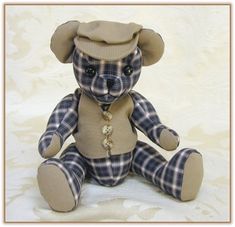 a teddy bear wearing a hat and necklace